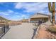 Desert backyard with covered patio, rock landscaping, and a glimpse of mountain views at 27145 N 147Th Ave, Surprise, AZ 85387