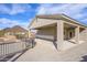 Covered patio with desert views, ceiling fans, and convenient access to the home's interior at 27145 N 147Th Ave, Surprise, AZ 85387