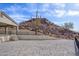 An outdoor patio features a beautiful mountain view, enclosed by black fencing, with a saguaro cactus at 27145 N 147Th Ave, Surprise, AZ 85387