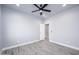 Bedroom featuring hardwood floors, a ceiling fan, recessed lights, and a doorway leading to another room at 27145 N 147Th Ave, Surprise, AZ 85387