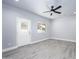 Bedroom with hardwood flooring, a ceiling fan, a door to the outside, and a window with a view at 27145 N 147Th Ave, Surprise, AZ 85387