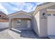 View of the exterior of the home, with a view of the front entrance of the house and an attached garage at 27145 N 147Th Ave, Surprise, AZ 85387