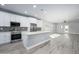 Open-concept kitchen with stainless steel appliances, ample counter space, and modern finishes at 27145 N 147Th Ave, Surprise, AZ 85387