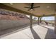 A spacious outdoor patio with ceiling fans and a great desert view at 27145 N 147Th Ave, Surprise, AZ 85387