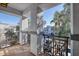 Charming balcony featuring decorative columns, gray railings, and neighborhood views at 295 N Rural Rd # 273, Chandler, AZ 85226