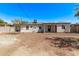 The backyard has a covered patio, block fence and an opportunity to design your dream outdoor space at 3035 W Pierce St, Phoenix, AZ 85009