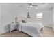 Bedroom with a ceiling fan, a window, and a closet at 3035 W Pierce St, Phoenix, AZ 85009
