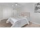 Bright bedroom with neutral decor, ensuite access, ceiling fan, and a closet at 3035 W Pierce St, Phoenix, AZ 85009