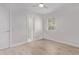 Bright bedroom with wood-look flooring, neutral walls and ceiling fan at 3035 W Pierce St, Phoenix, AZ 85009