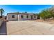 Wide driveway and home featuring a well-maintained exterior and a neatly landscaped front yard at 3035 W Pierce St, Phoenix, AZ 85009