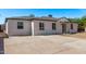 Wide driveway and home featuring a well-maintained exterior and a neatly landscaped front yard at 3035 W Pierce St, Phoenix, AZ 85009