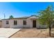Charming single-story home featuring a well-maintained exterior and a neatly landscaped front yard at 3035 W Pierce St, Phoenix, AZ 85009