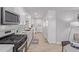 Bright, modern kitchen with white cabinets, stainless steel microwave and updated appliances at 3035 W Pierce St, Phoenix, AZ 85009