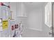 Bright laundry room with utility sink and overhead cabinets at 3035 W Pierce St, Phoenix, AZ 85009