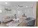 The living room showcases contemporary furnishings, a ceiling fan, and warm, inviting lighting at 3035 W Pierce St, Phoenix, AZ 85009