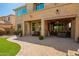 View of the backyard with the house, featuring a patio that seamlessly extends the indoor-outdoor living space at 3103 S Dakota Pl, Chandler, AZ 85248