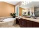 Relaxing bathroom featuring a soaking tub, double vanity, and neutral color palette at 3103 S Dakota Pl, Chandler, AZ 85248