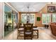 Elegant dining area filled with natural light, featuring a stylish pendant light and patio access at 3103 S Dakota Pl, Chandler, AZ 85248