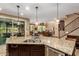Spacious kitchen featuring stainless steel appliances, granite countertops, and a view of the living area at 3103 S Dakota Pl, Chandler, AZ 85248