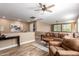 Inviting living room with comfortable seating, neutral walls, and a ceiling fan at 3103 S Dakota Pl, Chandler, AZ 85248