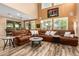 Open-concept living room with a tall ceiling, and a large sectional sofa, ideal for gatherings at 3103 S Dakota Pl, Chandler, AZ 85248