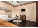 Cozy living room featuring dark hardwood floors, a modern sofa, and stylish decor at 3103 S Dakota Pl, Chandler, AZ 85248