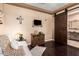 Bright living area with a sliding barn door, dark hardwood floors, and chic decor at 3103 S Dakota Pl, Chandler, AZ 85248
