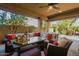 Inviting covered patio with comfortable seating and decor creates an ideal outdoor living space at 3103 S Dakota Pl, Chandler, AZ 85248