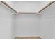 Walk-in closet with white shelving and storage space at 3349 E Carmel Ave, Mesa, AZ 85204