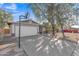 Traditional-style home featuring a two-car garage, basketball hoop, and desert landscaping at 3349 E Carmel Ave, Mesa, AZ 85204