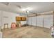 Spacious garage with ample storage cabinets and overhead lighting at 3349 E Carmel Ave, Mesa, AZ 85204