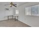 Bright office space with tile floors, white walls, natural light, and custom built desks at 3349 E Carmel Ave, Mesa, AZ 85204