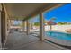 Spacious covered back patio area with access to a sparkling pool, perfect for outdoor entertaining and relaxation at 3730 E Diamond Ct, Gilbert, AZ 85297