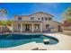This backyard features a refreshing pool, covered patio, and ample space for outdoor entertaining in the private yard at 3730 E Diamond Ct, Gilbert, AZ 85297