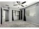 Well-lit bedroom with built-in closet organizers, carpet, and window offers ample storage and light at 3730 E Diamond Ct, Gilbert, AZ 85297