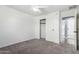Bedroom featuring neutral carpet, ceiling fan, and access to closet and bathroom at 3730 E Diamond Ct, Gilbert, AZ 85297
