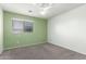 Neutral bedroom with plush carpeting and a bright window at 3730 E Diamond Ct, Gilbert, AZ 85297