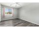 Bright bedroom with carpet, a ceiling fan, and large window offers a comfortable and inviting space at 3730 E Diamond Ct, Gilbert, AZ 85297