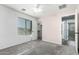 Cozy bedroom with plush carpet, large window, and an attached closet provides comfort and convenience at 3730 E Diamond Ct, Gilbert, AZ 85297