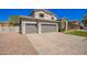 Attractive two-story home with a three-car garage, desert landscaping, and a spacious driveway at 3730 E Diamond Ct, Gilbert, AZ 85297