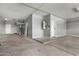 Spacious garage with concrete flooring, storage, and multiple access points offers ample parking and utility at 3730 E Diamond Ct, Gilbert, AZ 85297