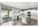 Bright kitchen with stainless steel appliances, granite countertops and view to the pool at 3730 E Diamond Ct, Gilbert, AZ 85297