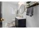 Bathroom featuring subway tile, modern vanity, patterned floor tiles, and round mirror at 385 E Coronado Rd # 5, Phoenix, AZ 85004