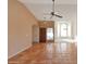 Bright and spacious living room featuring tile flooring, a ceiling fan, and large windows at 4080 W Orchid Ln, Chandler, AZ 85226