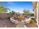 Outdoor patio area with seating, pizza oven, and desert landscaping at 42047 N Moss Springs Rd, Anthem, AZ 85086