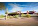 Beautiful clubhouse exterior with desert landscaping and vibrant blue sky at 42047 N Moss Springs Rd, Anthem, AZ 85086