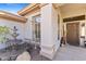 Inviting front entrance with a fountain and decorative rock landscaping at 42047 N Moss Springs Rd, Anthem, AZ 85086