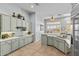 Bright kitchen featuring modern appliances, light blue cabinetry, and a breakfast nook at 42047 N Moss Springs Rd, Anthem, AZ 85086