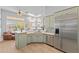 Bright kitchen with stainless steel appliances, marble countertops, and modern cabinets at 42047 N Moss Springs Rd, Anthem, AZ 85086