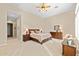 Comfortable primary bedroom with neutral decor, carpet flooring, and a dresser at 42047 N Moss Springs Rd, Anthem, AZ 85086